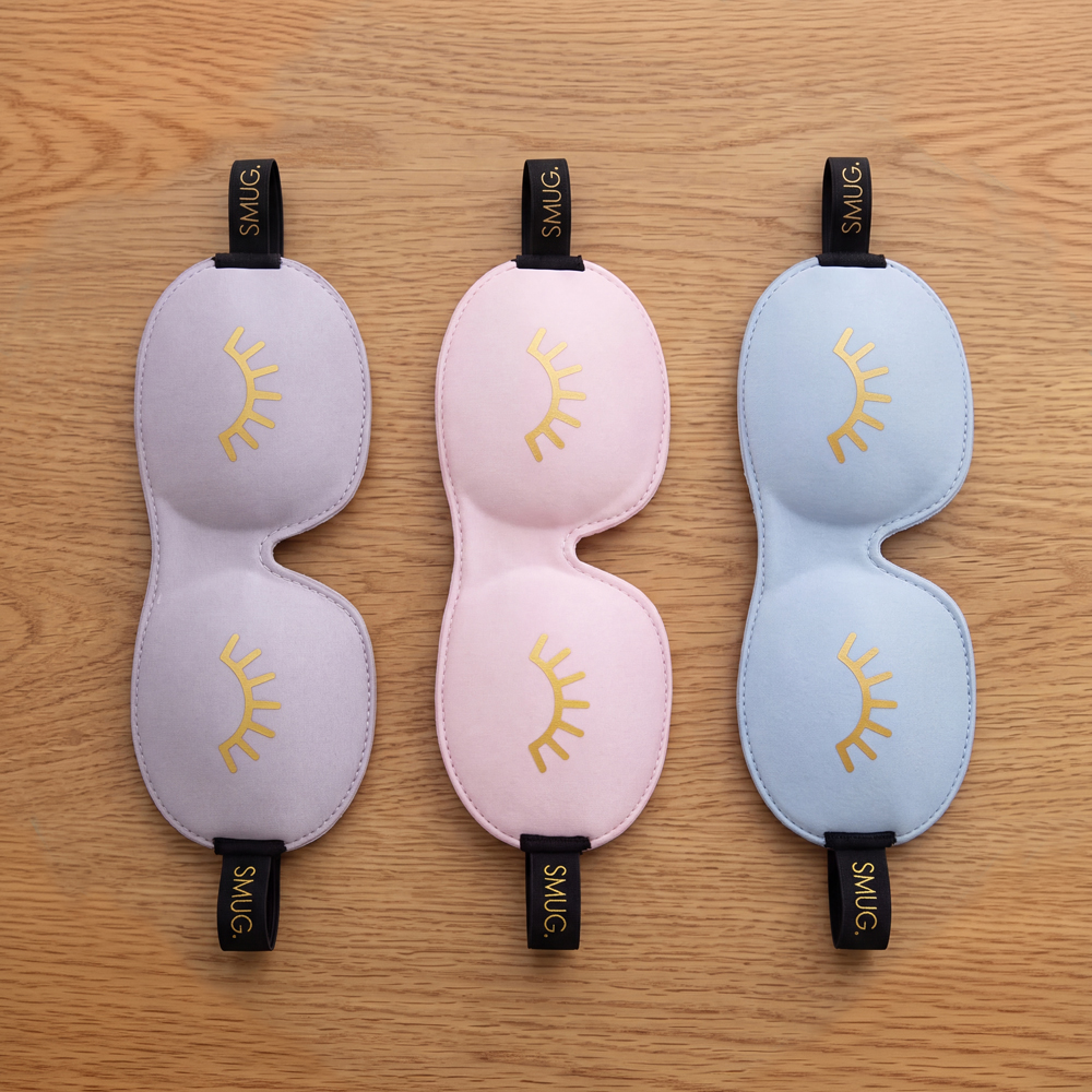 Three SMUG sleep masks in lilac, pink and blue